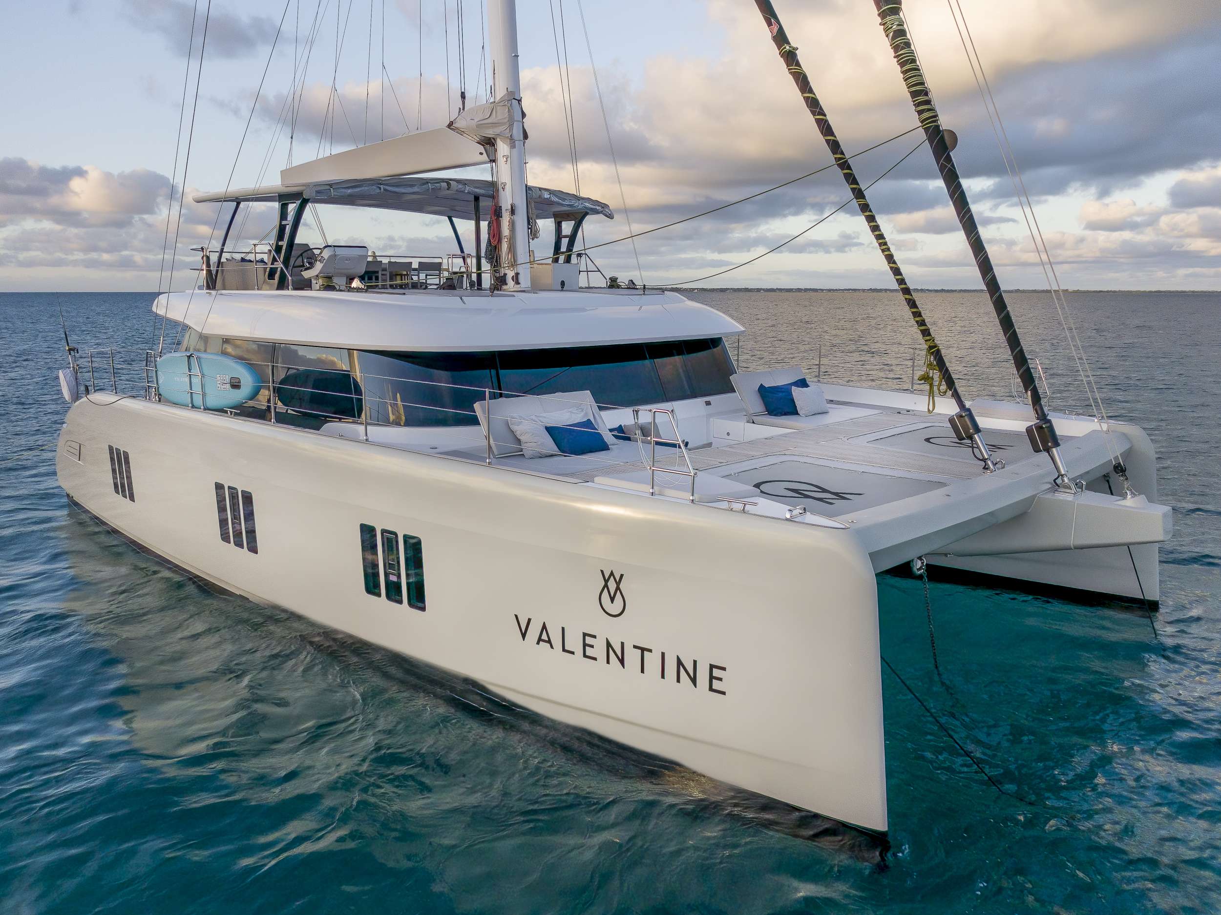 VALENTINE, a 2021 Sunreef 60 sailing catamaran, at anchor at dusk