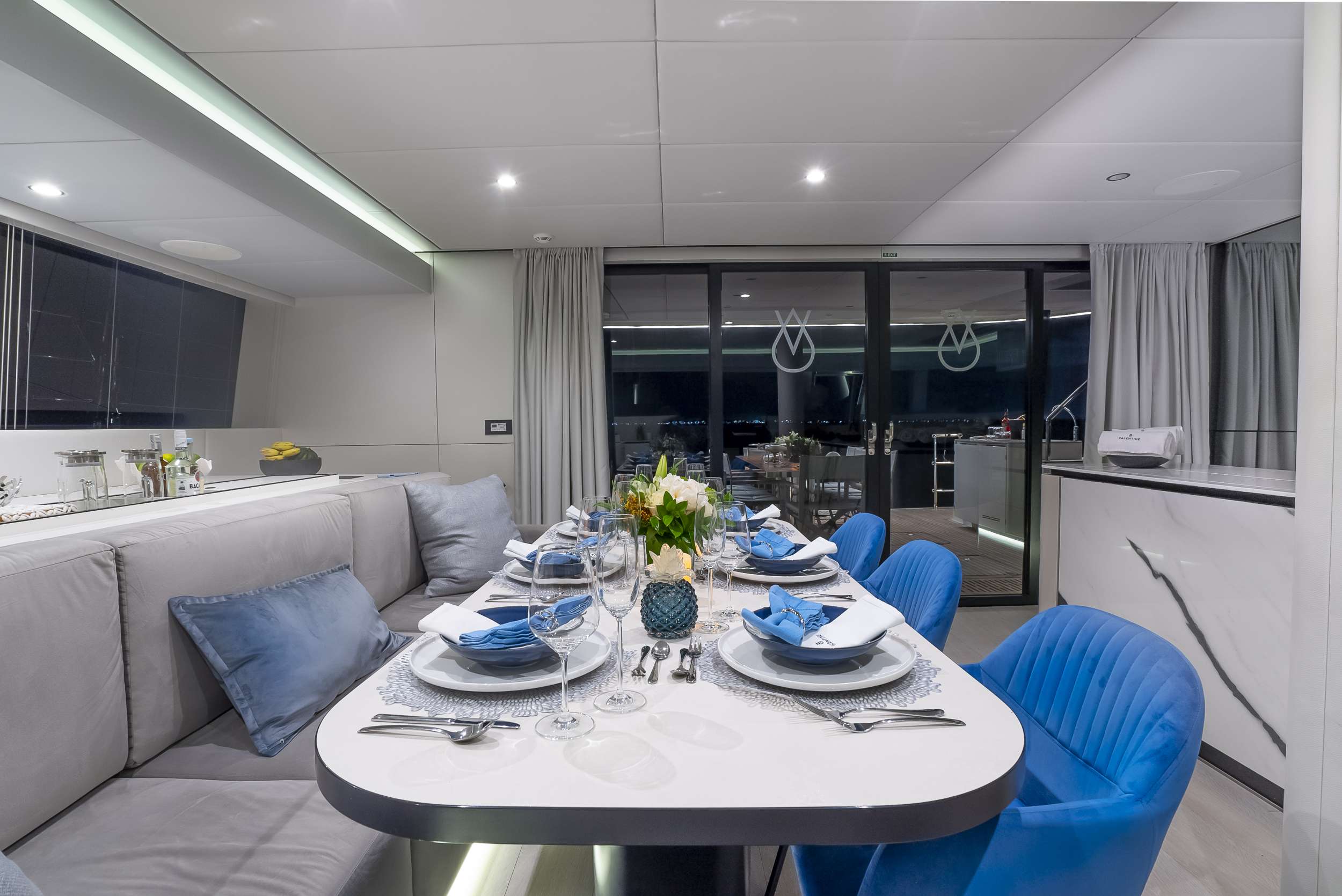 Salon dining opening onto the aft deck